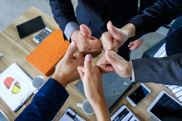 Businesman's hand showing thumd up sign