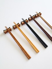 Beautiful collection of wooden chopsticks isolated on white background