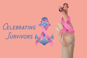 Composite image of cropped hand holding breast cancer awareness