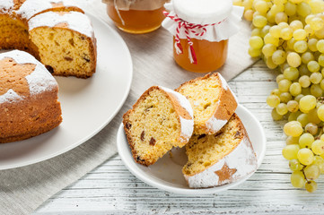 homemade traditional fruit cake slices at white wooden table
