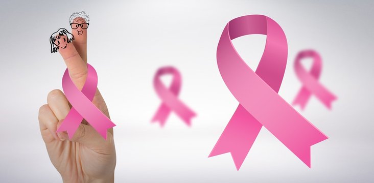 Composite image of cropped hand with breast cancer awareness