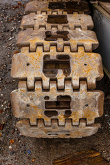 Large rusty caterpillar track.