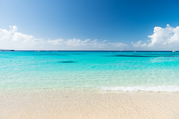 Beautiful white clouds on blue sky over calm sea