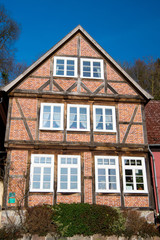 Fototapeta na wymiar House of red brick walls with windows