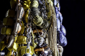 close up of various brilliant woman necklaces with black background. selective focus .