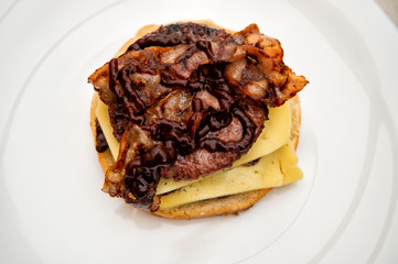 Sandwich with bread bun, beef meet, cheese slices