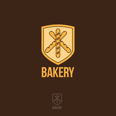 Bakery logo. Pastry emblem. Three baguette on a yellow shield.