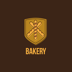 Bakery logo. Pastry emblem. Three baguette on a yellow shield.