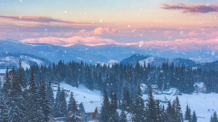 Fototapeta na wymiar Beautiful winter mountains in sunset light, snowy alpine landscape, favorite tourist destination in Carpathians, ski resort Drahobrat, Ukraine
