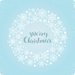 Merry Christmas greeting card template. Modern winter holidays lettering with circle frame from snowflakes on blue sky background. Merry Christmas vector illustration with text.