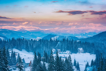 Fototapeta na wymiar Beautiful winter mountains in sunset light, snowy alpine landscape, favorite tourist destination in Carpathians, ski resort Drahobrat, Ukraine