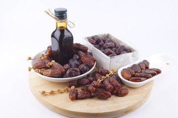 Close up concept of dried Dates and Dates concentrate on isolated white background.
