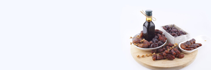 Close up concept of dried Dates and Dates concentrate on isolated white background.