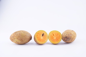 Sapodilla fruit on wooden isolated white background