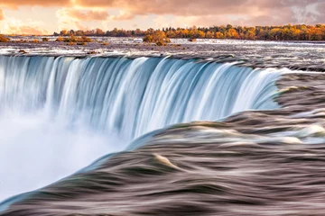 Foto auf Alu-Dibond Die Sonne geht über den Niagarafällen auf © Zak Zeinert
