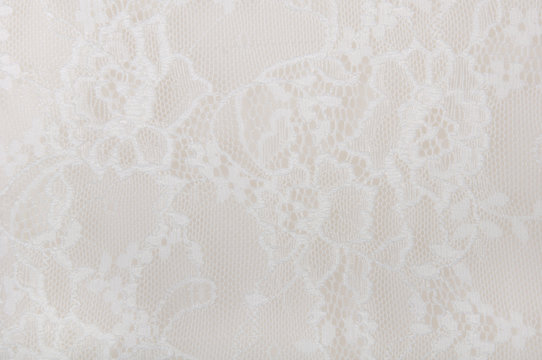 white floral lace on a white background