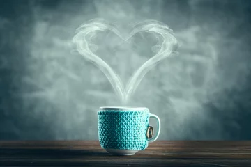 Foto op Plexiglas Cup of coffee with a heart shaped steam © George Dolgikh