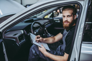 Handsome auto service mechanic