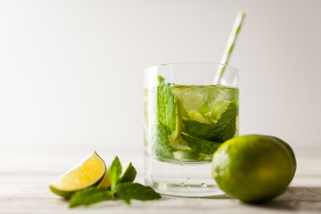 Mojito cocktail on white wood background