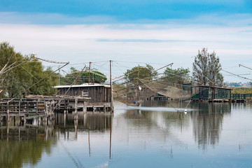 fishing trebuchets with nets on the water