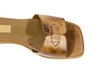 Female brown leather slipper on white background, isolated product.