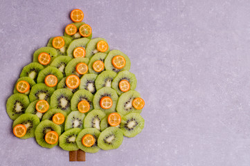 Christmas tree made of kiwi and kumquat