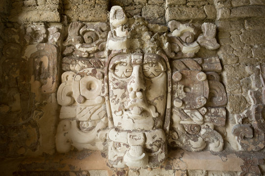 well preserved statue on the Temple of the Measks at Kohunlich maya archaeological site in Quintana Roo Mexico