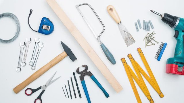 Top shot on DIY tools arranged on white background. 4k stop motion animation.