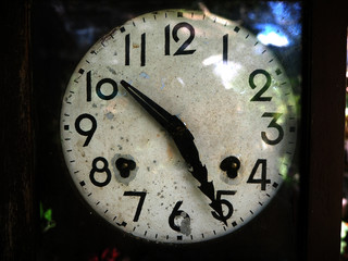 Old clock showing time at 10.25am