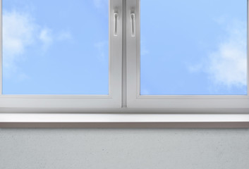 Clean window with an empty sill and blue sky

