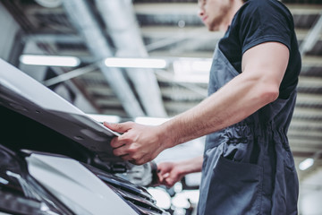 Handsome auto service mechanic