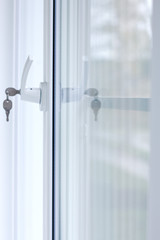 Secure window handle with key in closeup