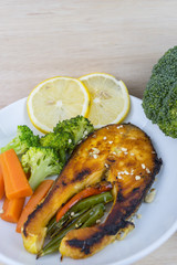Grilled Salmon with fresh salad and lemon. Selective focus