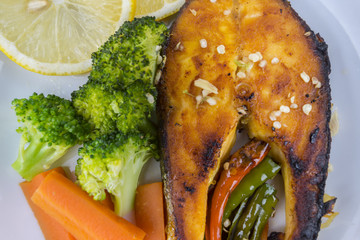 Grilled Salmon with fresh salad and lemon. Selective focus