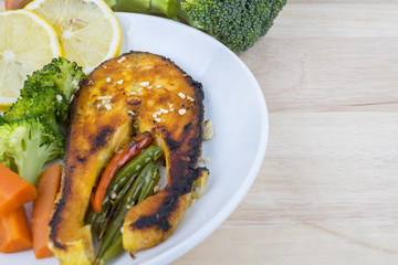 Grilled Salmon with fresh salad and lemon. Selective focus