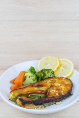 Grilled Salmon with fresh salad and lemon. Selective focus