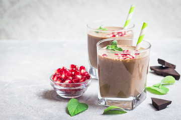Creamy hot chocolate pea nut butter pomegranate smoothie. Selective focus, space for text.