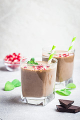 Almond milk veagan cocoa pomegranate smoothie. Selective focus, space for text.