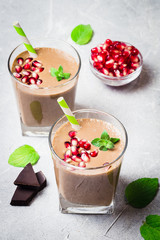 Peanut butter chocolate pomegranate smoothie. Selective focus, space for text.