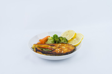 Grilled Salmon with fresh salad and lemon. Selective focus