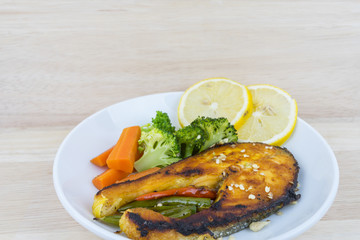 Grilled Salmon with fresh salad and lemon. Selective focus