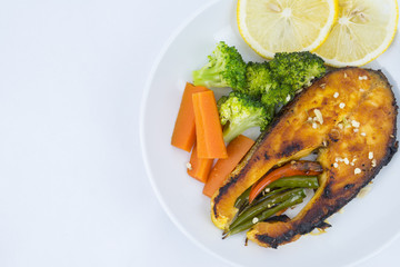 Grilled Salmon with fresh salad and lemon. Selective focus
