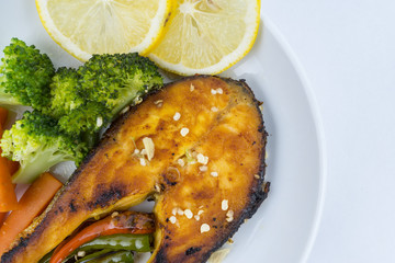Grilled Salmon with fresh salad and lemon. Selective focus