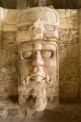 well preserved statue on the Temple of the Masks at Kohunlich maya archaeological site in Quintana Roo Mexico