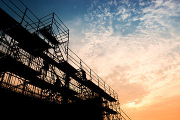 Civil engineer and safety officer in spec steel truss structure scaffolding risk analysis in...