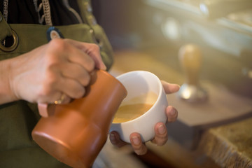 Fototapeta na wymiar Cup of coffee with beautiful Latte art Selective focus