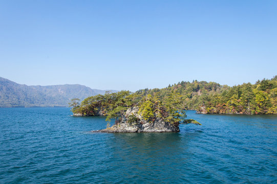Scenic view of lake Towada with small islands, Aomori, Oirase Gorge, Japan