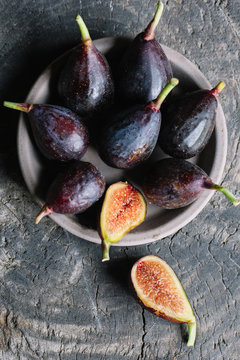 Fresh figs on wooden table