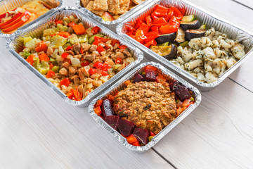 Healthy food take away, top view at wood background