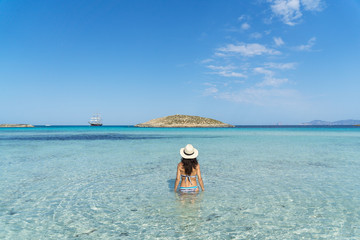 Young woman in a paradise beach